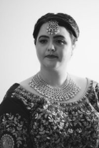 Brunette Woman in Dress with Necklace